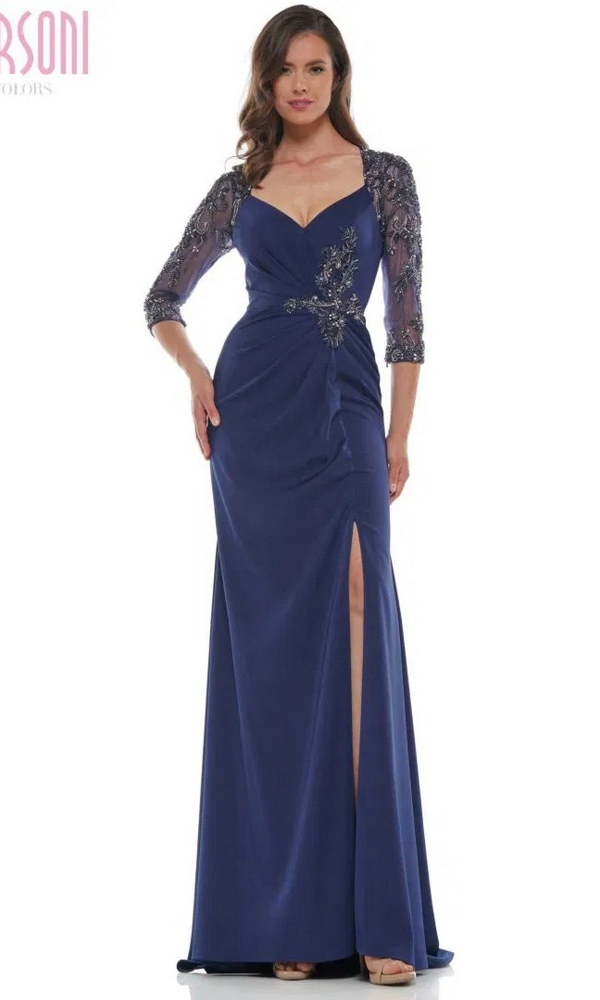 Woman in a navy Marsoni MV1070 long formal dress featuring sheer embroidered sleeves, a sweetheart neckline, and a thigh-high slit for an elegant yet modest evening look.
